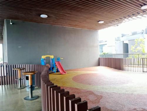 a room with chairs and stools in a building at The Cozy Rooms at The Ayoma Residence, BSD Serpong in Pondok-sentul
