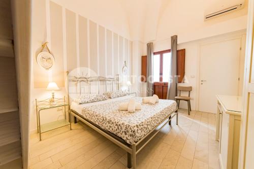 Postel nebo postele na pokoji v ubytování InCentro b&b