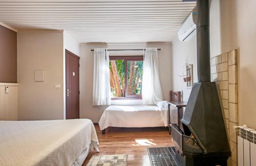 Katil atau katil-katil dalam bilik di Hotel Canto Verde