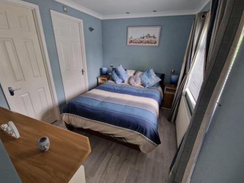 Katil atau katil-katil dalam bilik di Windermere lodge,sleeps 6