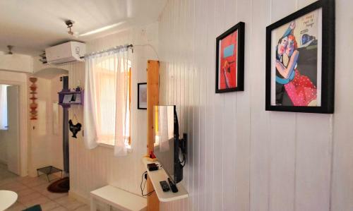 a room with a wall with a picture of a woman on it at Apartment Zlatko in Šibenik