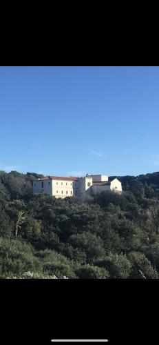 a group of white buildings on top of a hill at Domaine du Couvent de Saint Julien in Bonifacio