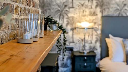 a wooden table with candles on it in a room at INNit Bliss in Brighton & Hove