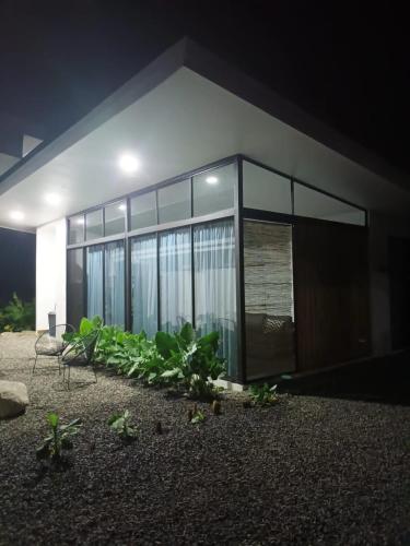 a house at night with plants in front of it at Villa Tanager in Fortuna