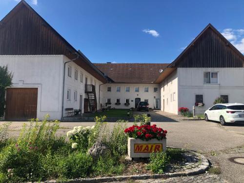 a large white building with a sign that says water at Babsi Appartments - leben am Land in Wels