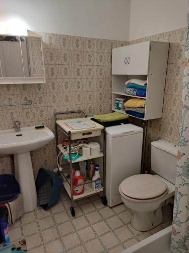 a small bathroom with a toilet and a sink at Beau studio meublé hyper centre Nice in Nice
