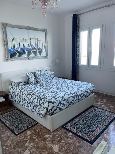 Ένα ή περισσότερα κρεβάτια σε δωμάτιο στο Casa Sulla Laguna