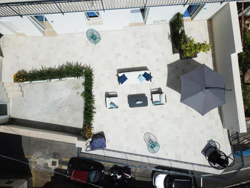 an overhead view of a patio with an umbrella at Blue View Luxury Rooms in Furore