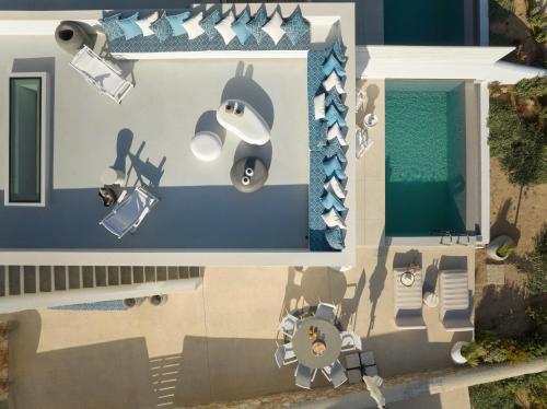 an overhead view of a house with a penguin graphic on the side at Villa Le22, 180 panoramic sea views, Paros in Kampos Paros