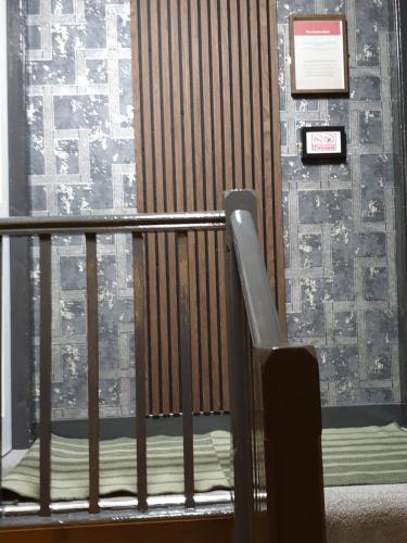a balcony with a stair railing and a window at BELLFIELD HOUSE in Broadford