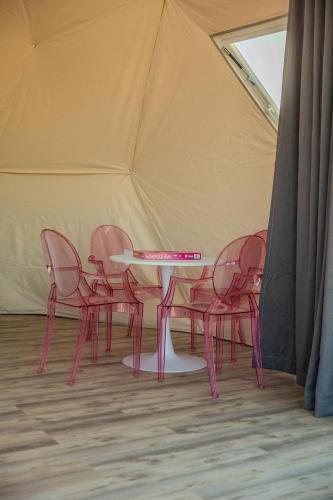 a pink table and chairs in a tent at The Hive in Willcox