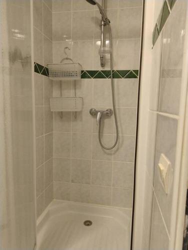 a bathroom with a shower with a tub and a toilet at lou caladou gîte en pierre avec bain à remous in Vallon-Pont-dʼArc
