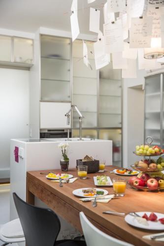 a table with food on it in a kitchen at Hallstatt Hideaway - Adults only in Hallstatt