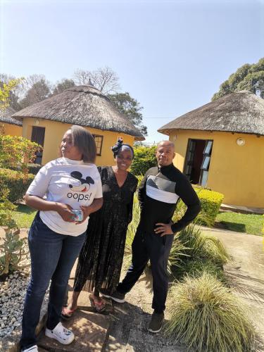 a group of people standing in front of a house at Lunganakho Country Lodge in Port Edward