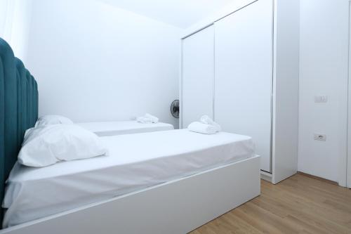 Postel nebo postele na pokoji v ubytování Romina Apartment