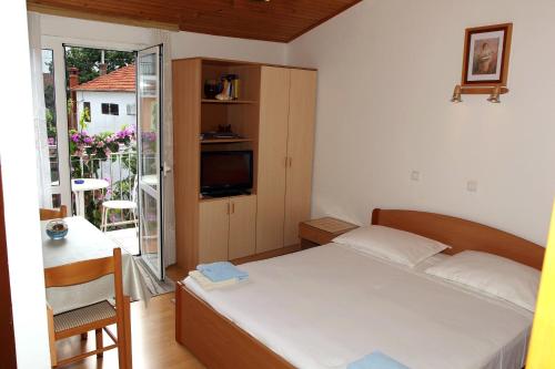 Postel nebo postele na pokoji v ubytování Apartments J&R Babara