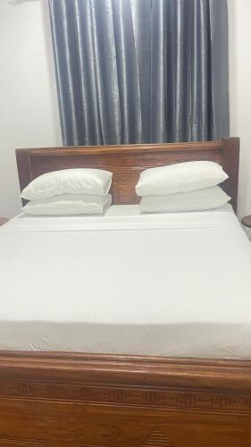 Ένα ή περισσότερα κρεβάτια σε δωμάτιο στο PM Lodge and Restaurant