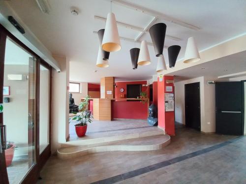 a hallway of an office with some lights and plants at L'incanto Blu in Teulada