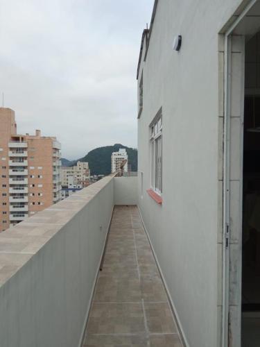 a balcony with a view of a city at Espaço Acolhedor perto da Praia. in São Vicente