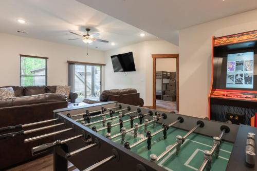 a living room with a large pool table at 3BR Walk-In Near Silver Dollar City - Game Room - Pool - FREE TICKETS INCLUDED - RR93A in Branson