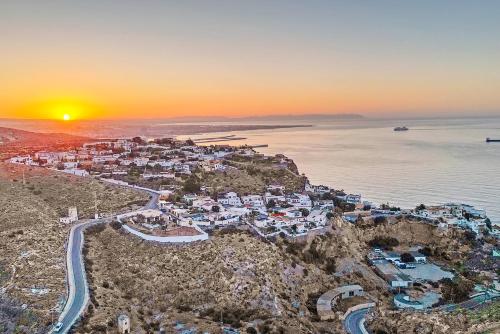 an aerial view of a town on a hill next to the ocean at Villa Infinity sea views I Pool I BBQ I Jacuzzi in Almería