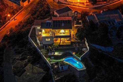 an aerial view of a house with a swimming pool at Villa Infinity sea views I Pool I BBQ I Jacuzzi in Almería