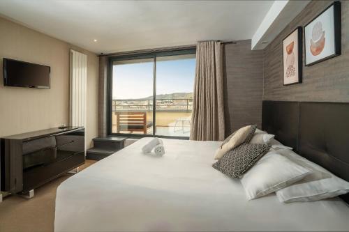 Postel nebo postele na pokoji v ubytování Best Western Hotel Le Quercy