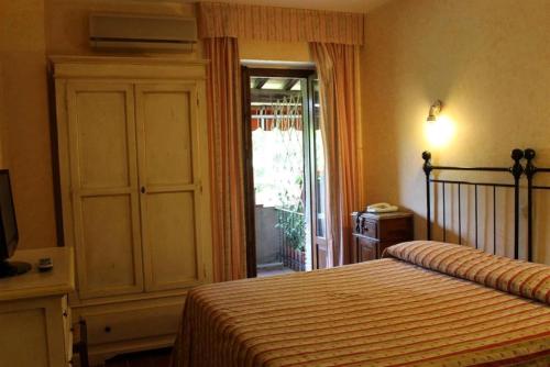 Antico Casale Di Scansano Resortにあるベッド