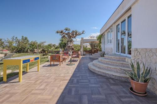 a patio with stairs and a building at Extravacanza Polignano a Mare in Polignano a Mare