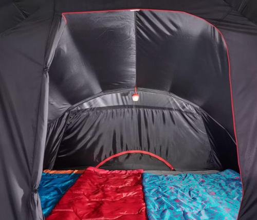 a black tent with a bed in it at Tenda Photok Camping Reception in Funchal