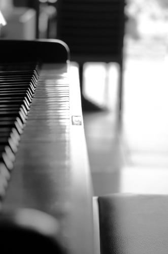 a black and white photo of a piano at Porto Veneziano Hotel in Chania Town