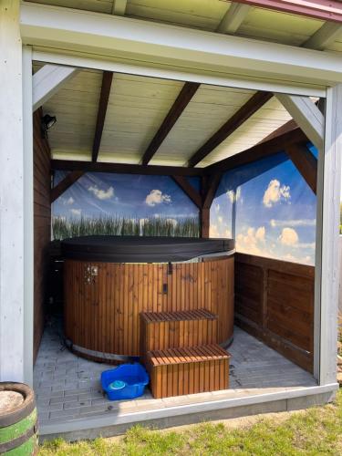 a jacuzzi in a building with a sky at Dom całoroczny Wczasy jak Marzenie in Ruciane-Nida