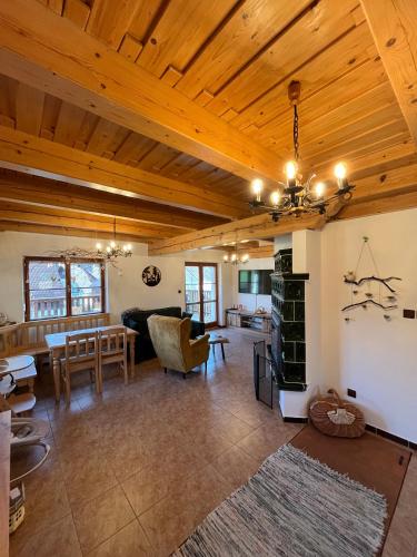 a large living room with a wooden ceiling at U farmy in Velhartice