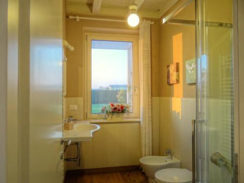 a bathroom with a sink and a window at B&B La Magia dei Sogni Relais in Verona