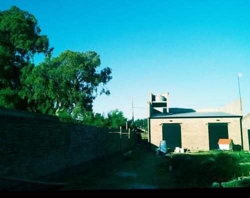 a building with a fence in front of it at Josefina casa in Punta Alta