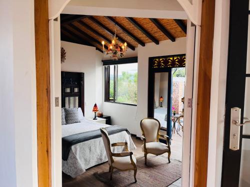 Postel nebo postele na pokoji v ubytování Hotel Caney campestre Villa de Leiva