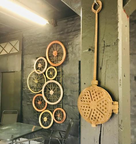 a group of bicycle wheels hanging on a wall at Historic manoir in Vire Normandy elegance in a semi-rural setting ideal for groups and families in Vire