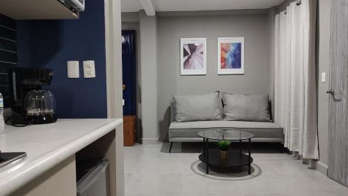 a living room with a couch and a table at WUER Expiatorio in León