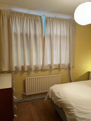 a bedroom with a bed and a window at Kilmactrasna Cottage in Carrickmacross