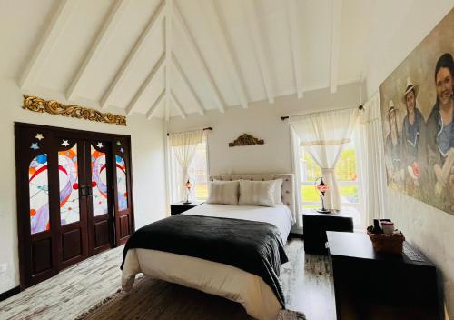 Postel nebo postele na pokoji v ubytování Hotel Caney campestre Villa de Leiva