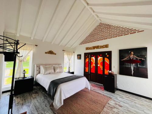 Postel nebo postele na pokoji v ubytování Hotel Caney campestre Villa de Leiva