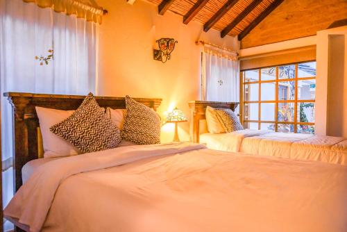Postel nebo postele na pokoji v ubytování Hotel Caney campestre Villa de Leiva
