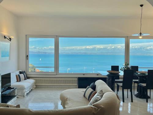 a living room with a large view of the ocean at [porto santo stefano] vista mare + parcheggio gratuito in Porto Santo Stefano