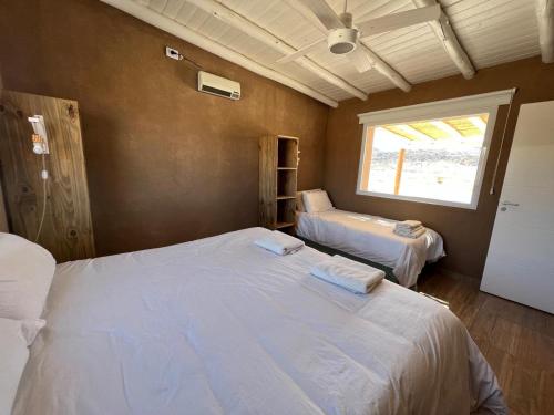 A bed or beds in a room at El Campito Cabaña para 5 personas
