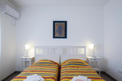 Postel nebo postele na pokoji v ubytování Casa Asseca - Tavira centro
