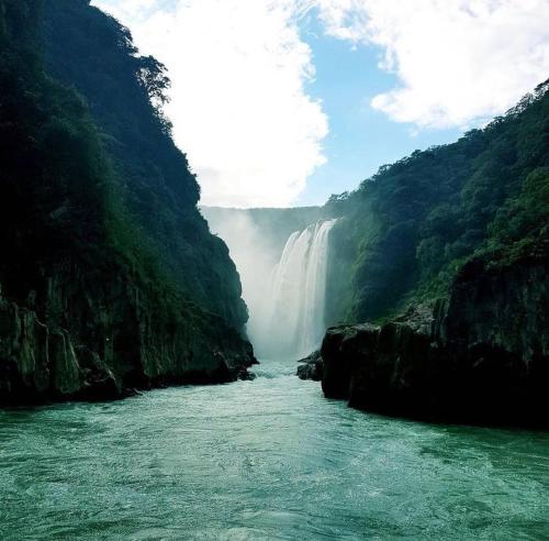 a waterfall in the middle of a river at Casa La Prieta Linda in Tamasopo