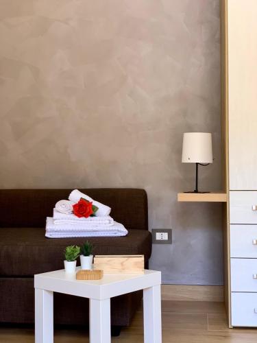 a living room with a couch and a table at Griseo - Sicily Vista in Calatabiano