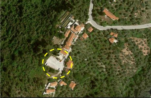 an aerial view of a house in a field at BLUE, Traditional House in Klíma