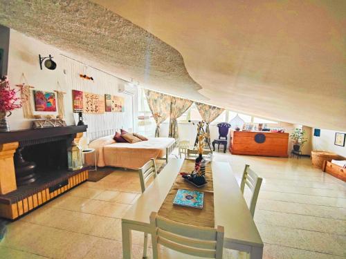 a living room with a couch and a fireplace at O' Frechete! in Sulmona