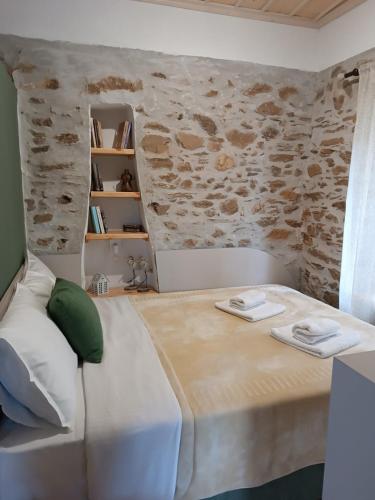 a bedroom with a bed with two towels on it at Casa Lehovo in Lechovo